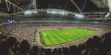 crowd watching football game inside stadium