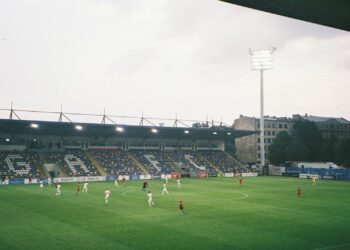 a group of people playing football