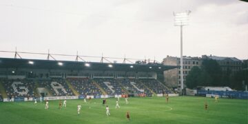 a group of people playing football